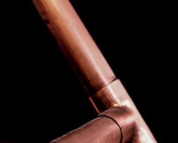 Copper Pipes on Black Background